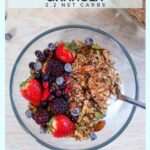 a bowl of keto chocolate granola with berries