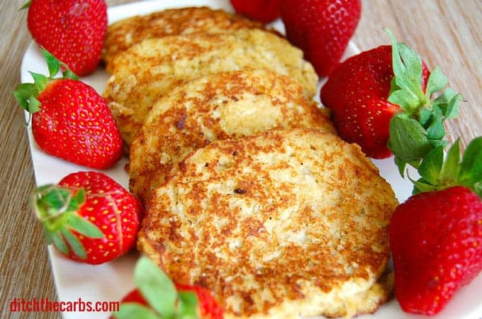 Coconut flour pancakes served with fresh strawberries