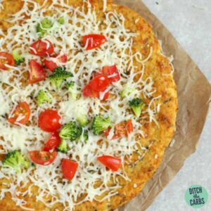 cauliflower pizza on baking parchment