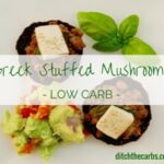 Simple low carb Greek inspired stuffed mushrooms - with lamb, basil, haloumi and sundried tomato. All of this and they are low carb, gluten free, grain free and whole food. | ditchthecarbs.com