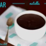Sugar-Free Nutella on a folded blue and white napkin with silver spoon