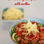 Spaghetti Bolognese served with zoodles and shredded cheese