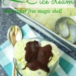 Sugar free mint ice cream in a glass bowl, silver spoon and a blue check cloth