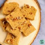 sliced sugar-free pumpkin pie fudge on a slice of wood