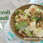A green antique bowl of low-carb bacon broccoli cauliflower salad