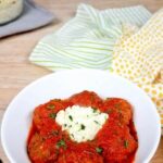 Easy Low-Carb Instant Pot Meatballs served with sour cream in a white bowl