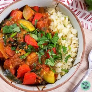 A plate of lamb stew in front of the instant pot