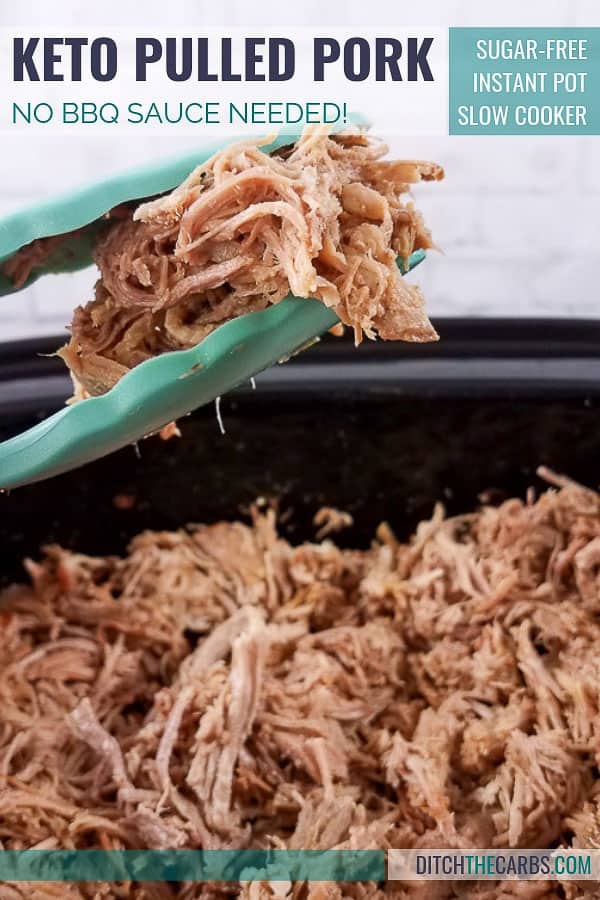 Blue tongs lifting up keto slow cooker pulled pork from the slow cooker
