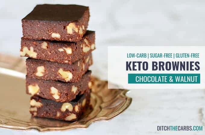 Chocolate and walnut keto brownie sliced and stacked on a silver fluted plate