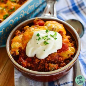 keto chili casserole in a bowl served with sour cream