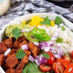 Burrito bowls with colourful vegetables and salad