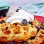 Chocolate chip chaffles served with whipped cream on a plate for a best low-carb snack