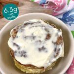 low-carb cinnamon roll served in a bowl with cream cheese frosting
