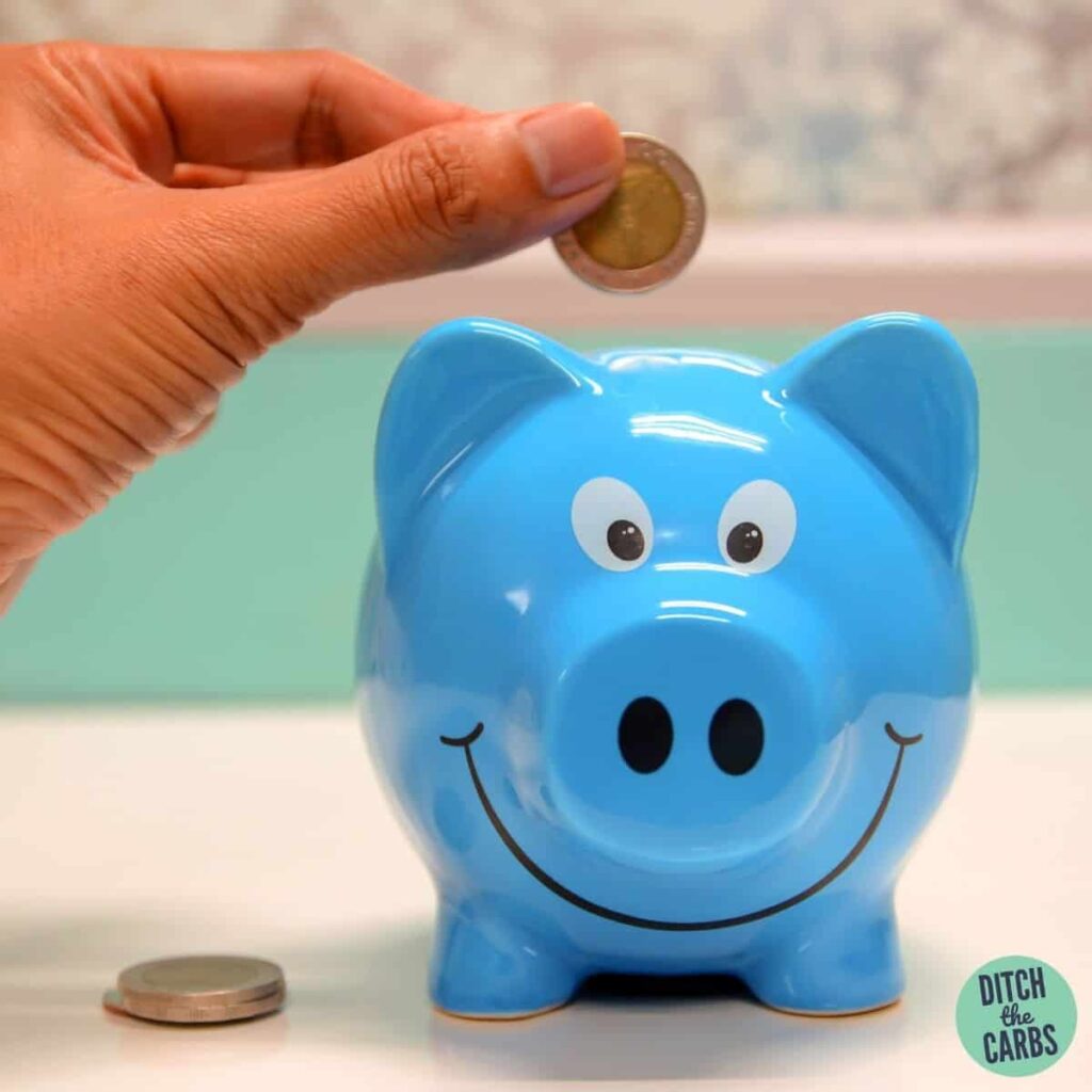 a blue piggy bank with a penny