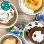 Four different low-carb mug cakes in light blue bowls.