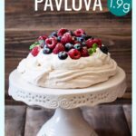 sugar-free pavlova with cream and berries on a serving plate
