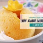 Lemon Curd Low-Carb Mug Cake in a dish with whipped cream on the side.