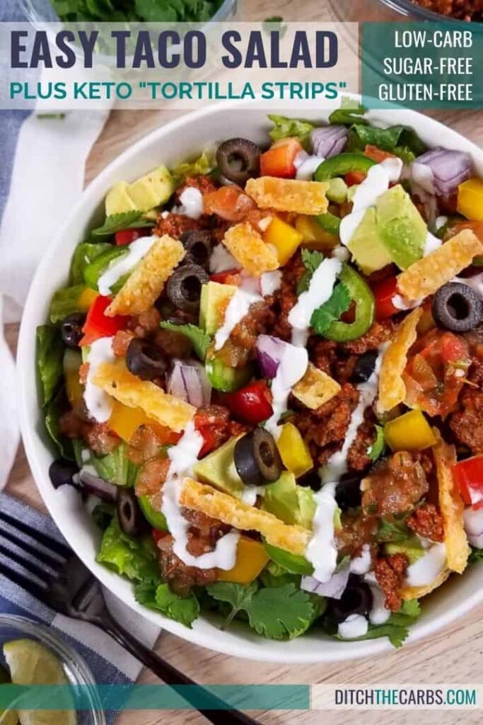 taco salad served in a white bowl on a Mexican coloured table cloth