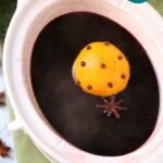 mulled wine being prepared in a slow cooker