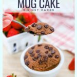 baked chocolate keto mug cake with sugar-free chocolate chips being eaten with a spoon