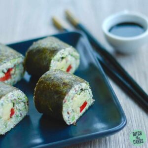 sushi with cauliflower rice on a black plate