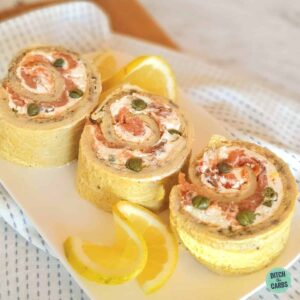 rolled smoked salmon roulade sliced with lemons