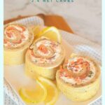 rolled smoked salmon roulade sliced with lemons