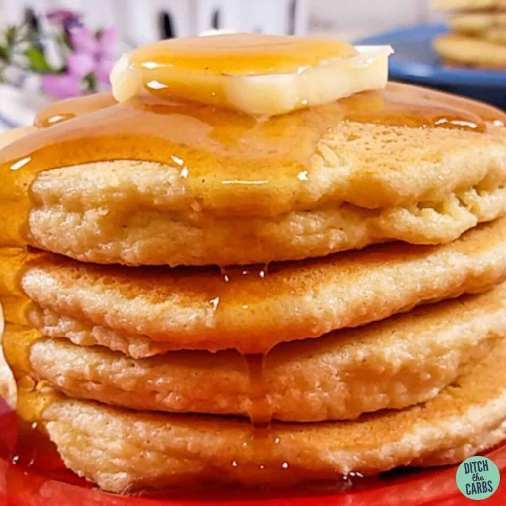 gluten-free keto pancakes on a plate with a sugar-free syrup