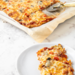 Eating keto doesn't mean you have to give up pizza. And while pizza preference can be a very subjective thing, this easy cauliflower crust, low carb pizza was universally liked by all who tried it!