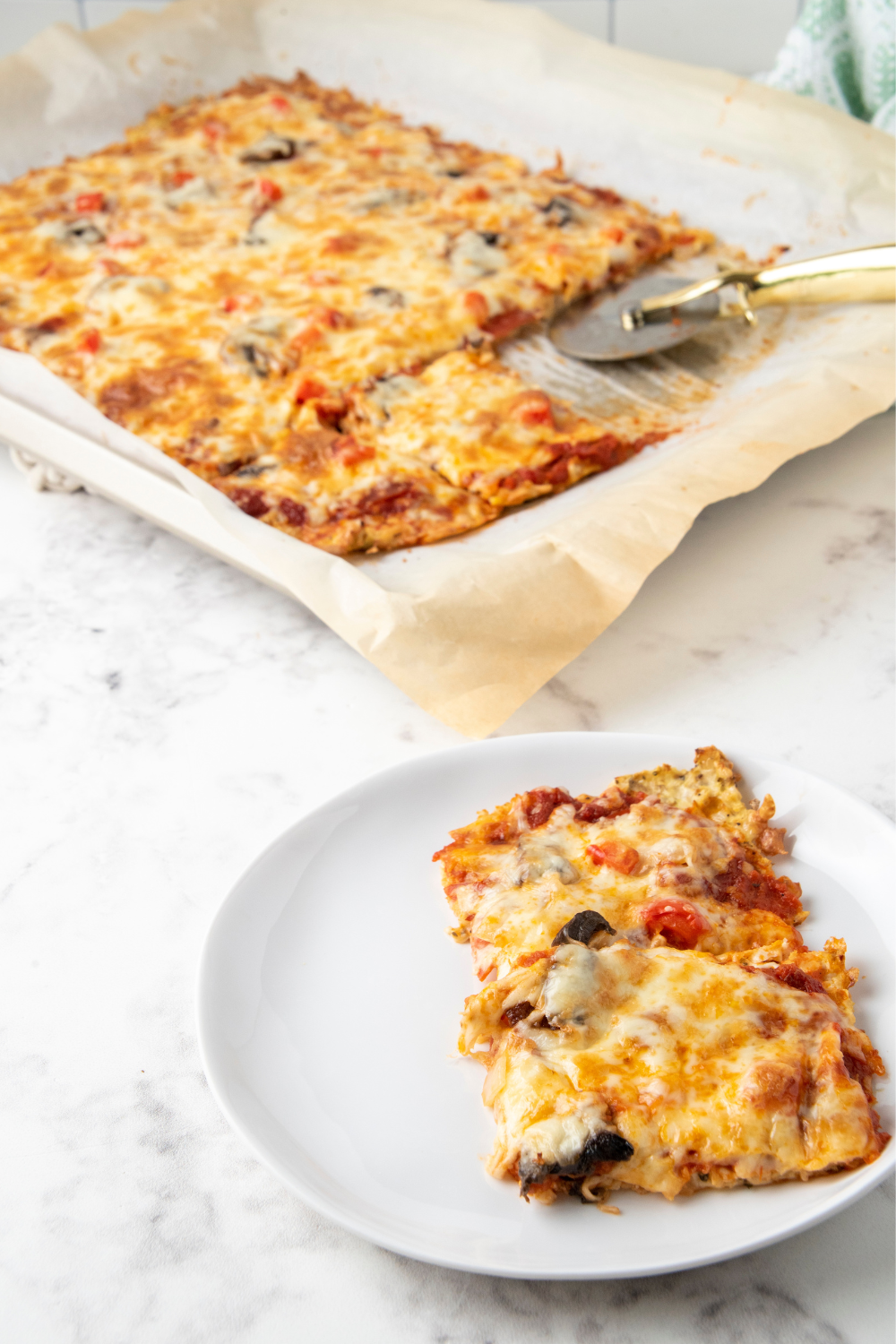 Eating keto doesn't mean you have to give up pizza. And while pizza preference can be a very subjective thing, this easy cauliflower crust, low carb pizza was universally liked by all who tried it!