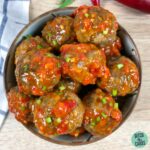 Overhead image of a bowl filled with spicy garlic meatballs