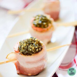 Bacon Wrapped Salmon Pesto Recipe on a black plate