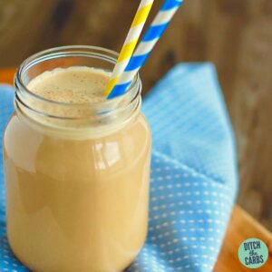 keto coffee dairy-free in a glass jar with 2 straws