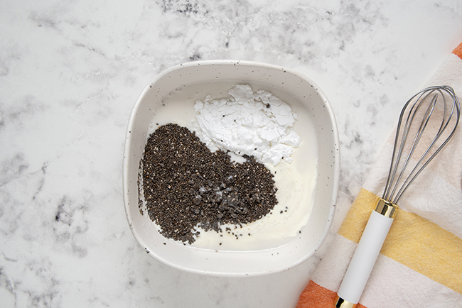 mixing together a low-carb pudding with chia seeds