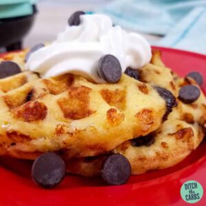 Chocolate chip chaffles served with whipped cream and sugar-free chocolate chips