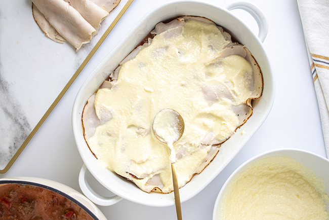 Spreading ricotta cheese layer to the low-carb lasagna