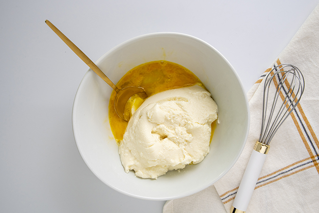 Whisking egg and ricotta cheese 