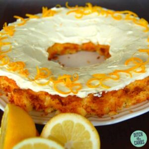 Lemon Coconut Cake decorated with cream cheese frosting and lemon zest