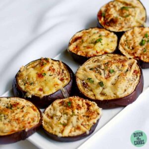 A plate of baked eggplant with melted parmesan