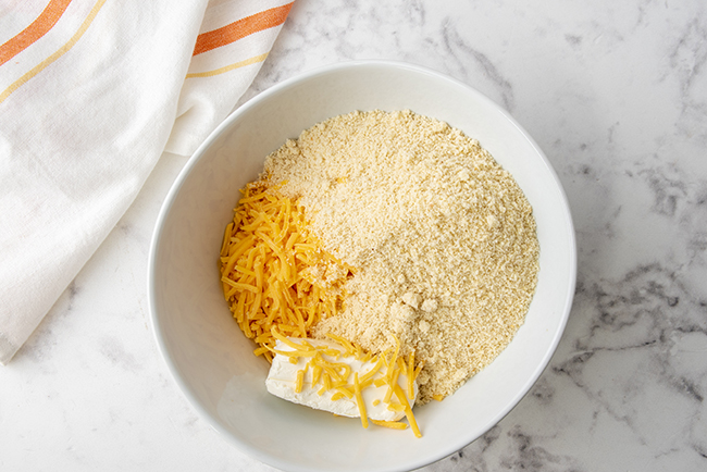 mixing together ingredients for low carb crackers