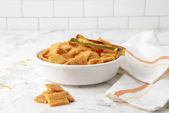 Bowl full of homemade low carb crackers made with cheddar cheese