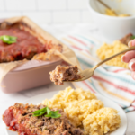This low-carb meatloaf is full of bold flavors and stays super moist thanks to the addition of heavy cream. It's simply delicious, a family favorite, and perfect for guests!