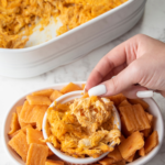 This easy Buffalo chicken dip is creamy, slightly-spicy, and the perfect thing to serve at parties or to eat as a post-workout snack.