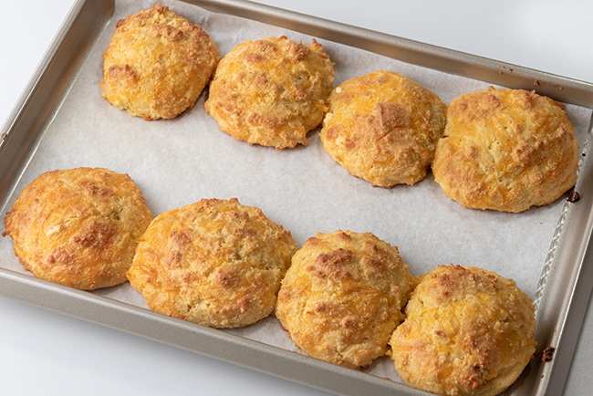 Cheddar biscuits on a baking tray