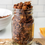 This keto breakfast recipe is gluten-free, grain-free, and easy! Make low-carb granola that you can eat for breakfast or eat it as a snack on your next hike.